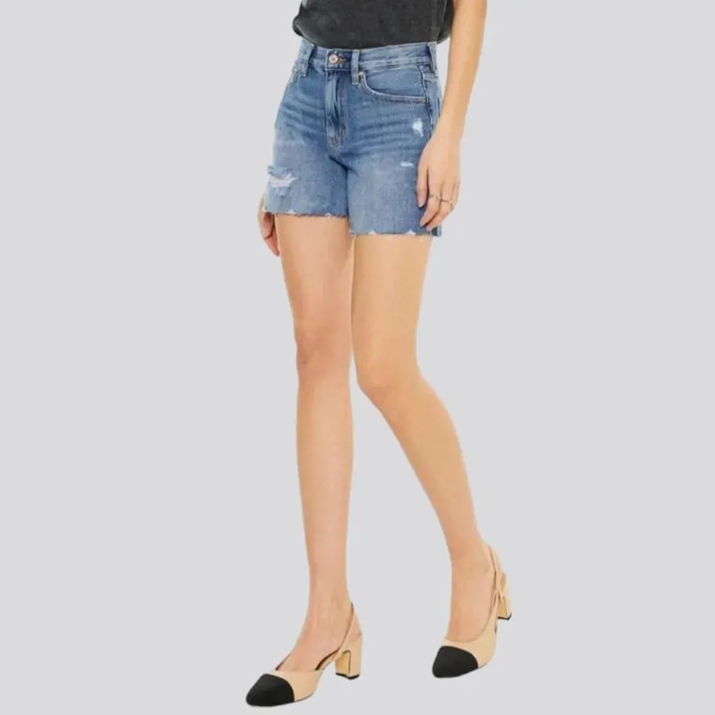 Medium-wash whiskered jeans shorts for women