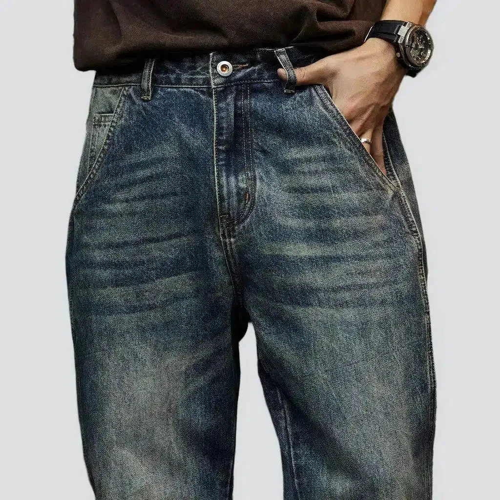 Sanded medium-wash jeans
 for men